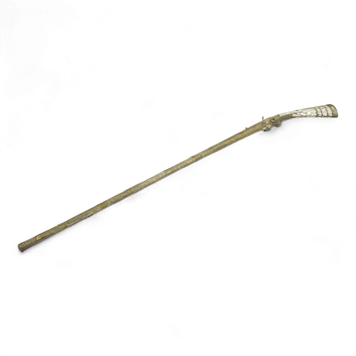 A Balkan miquelet flintlock gun with part octagonal Damascus twist barrel, silver inlaid at breach and muzzle, brass covered stock with shaped mother-of-pearl segments covering the butt, the side of stock inscribed ‘Piet